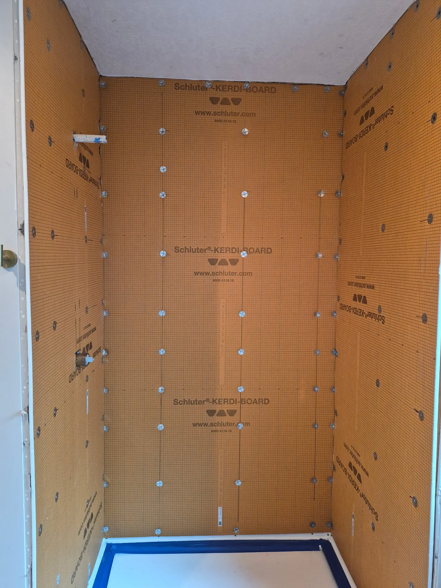 Shower preparation with wall backer board before tile installation
